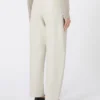 Broek met wijd uitlopende pijpen van gecoate stof, zandkleur Broek met wijd uitlopende pijpen van gecoate stof, zandkleur