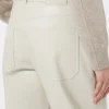 Broek met wijd uitlopende pijpen van gecoate stof, zandkleur Broek met wijd uitlopende pijpen van gecoate stof, zandkleur