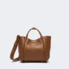 Extra kleine leren tas in marineblauw, bruin-brons Extra kleine leren tas in marineblauw, bruin-brons