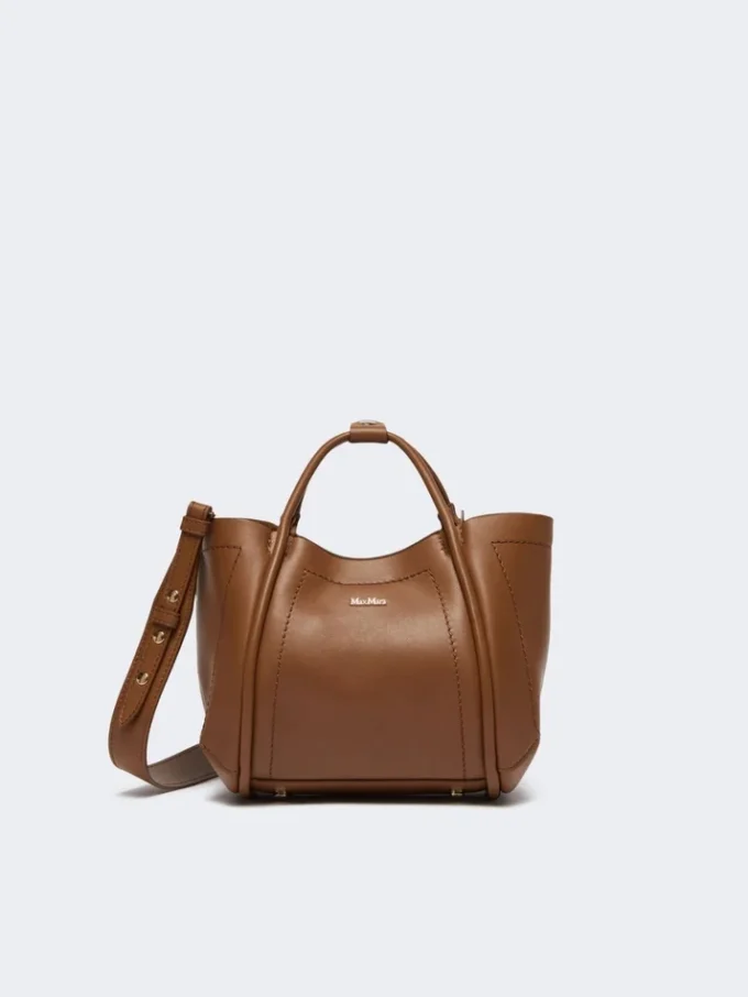 Extra kleine leren tas in marineblauw, bruin-brons Extra kleine leren tas in marineblauw, bruin-brons