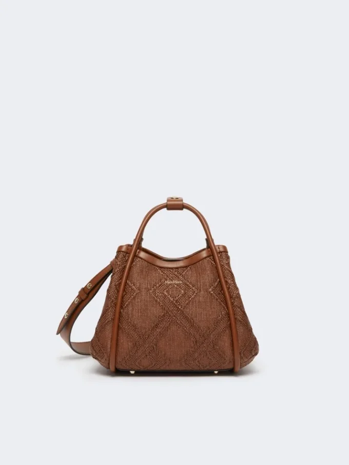 Extra kleine maritieme tas in mandvlechtwerk met ruitpatroon, amberbruin Extra kleine maritieme tas in mandvlechtwerk met ruitpatroon, amberbruin