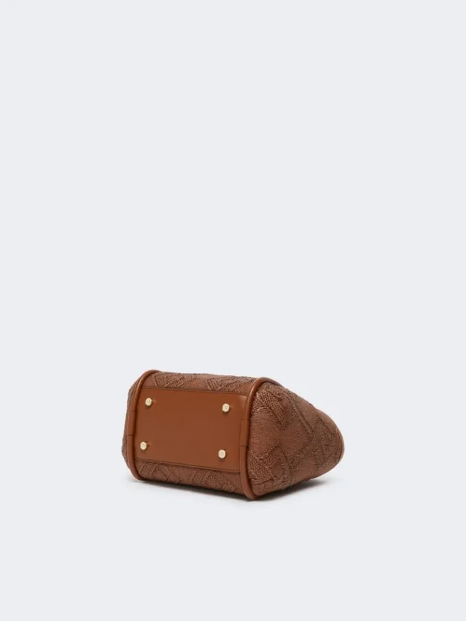 Extra kleine maritieme tas in mandvlechtwerk met ruitpatroon, amberbruin Extra kleine maritieme tas in mandvlechtwerk met ruitpatroon, amberbruin