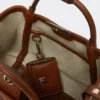 Extra kleine maritieme tas in mandvlechtwerk met ruitpatroon, amberbruin Extra kleine maritieme tas in mandvlechtwerk met ruitpatroon, amberbruin