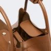 Kleine leren tas in marineblauw, bruin-brons Kleine leren tas in marineblauw, bruin-brons