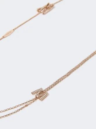 Lange ketting met monogramdetails, ivoorkleurig