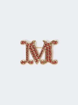 Met kristallen versierde monogrambroche, rood