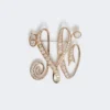 Monogrambroche met strass, ivoorkleurig Monogrambroche met strass, ivoorkleurig