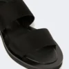 Platte sandalen van leer en elastische banden, zwart